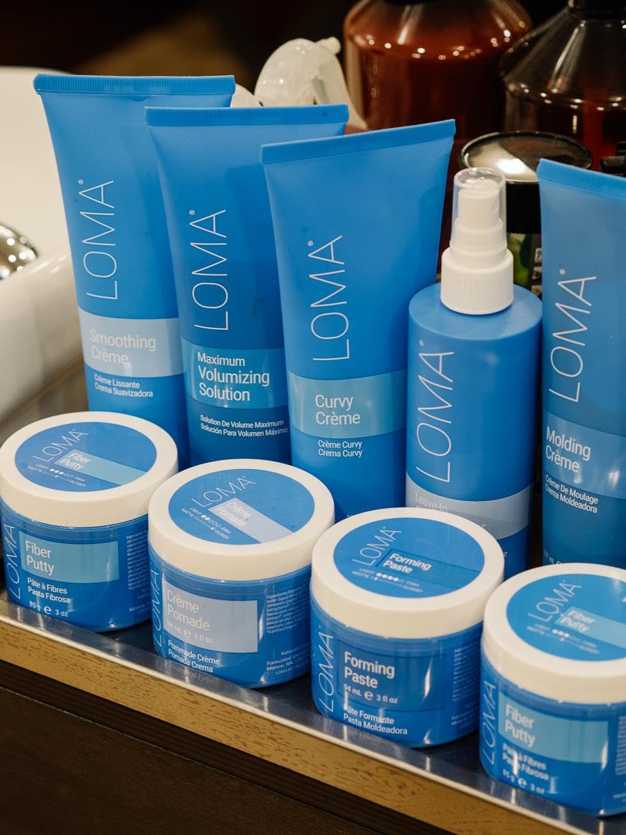 Loma smoothing crème applied on damp hair before blow-dry for heat protection benefit