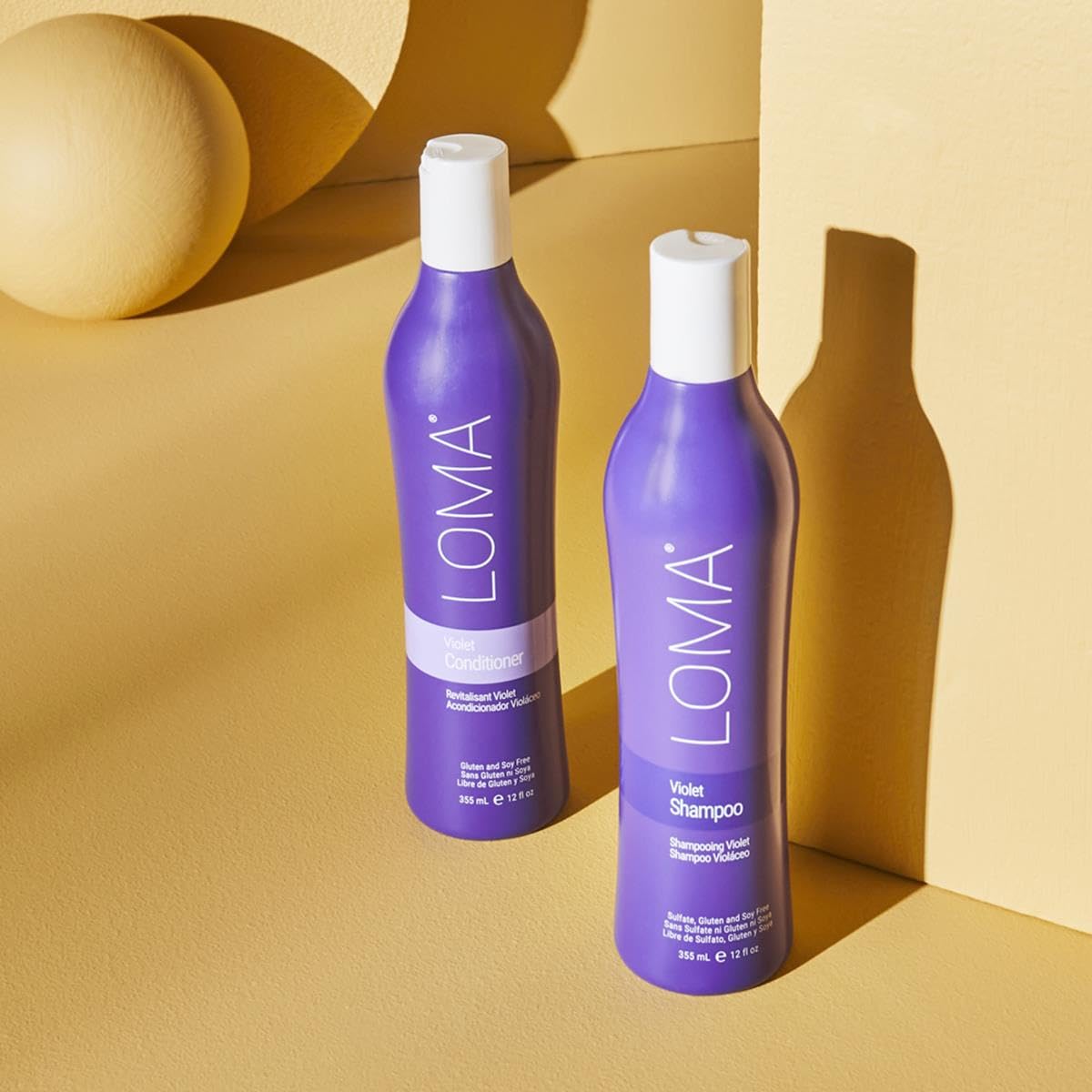 Close-up of Loma shampoo texture demonstrating creamy violet pigment for toning