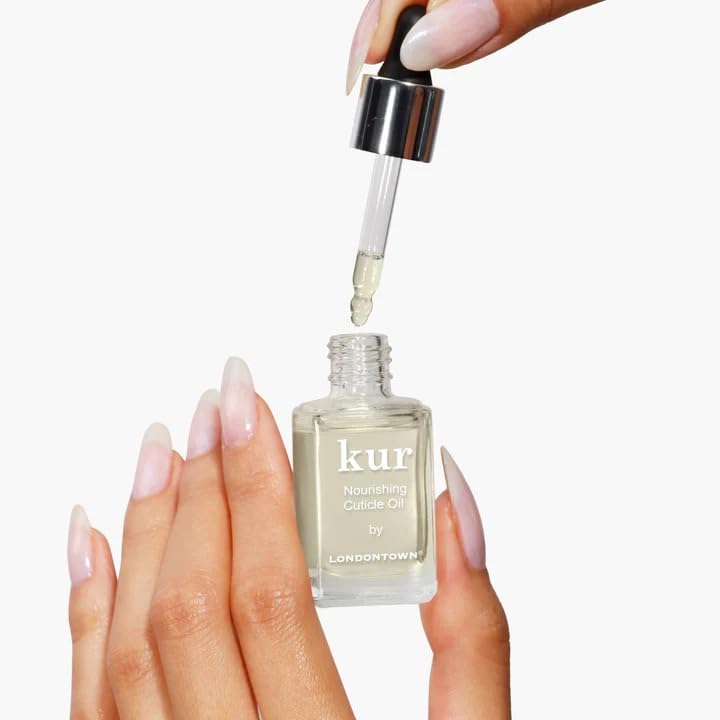 LONDONTOWN oil on fingertip being massaged into cuticle for softness