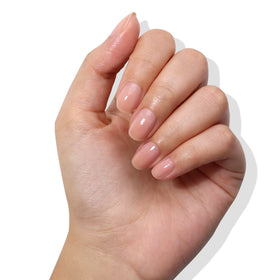 LONDONTOWN dusty rose swatch on a nail tip showing subtle color