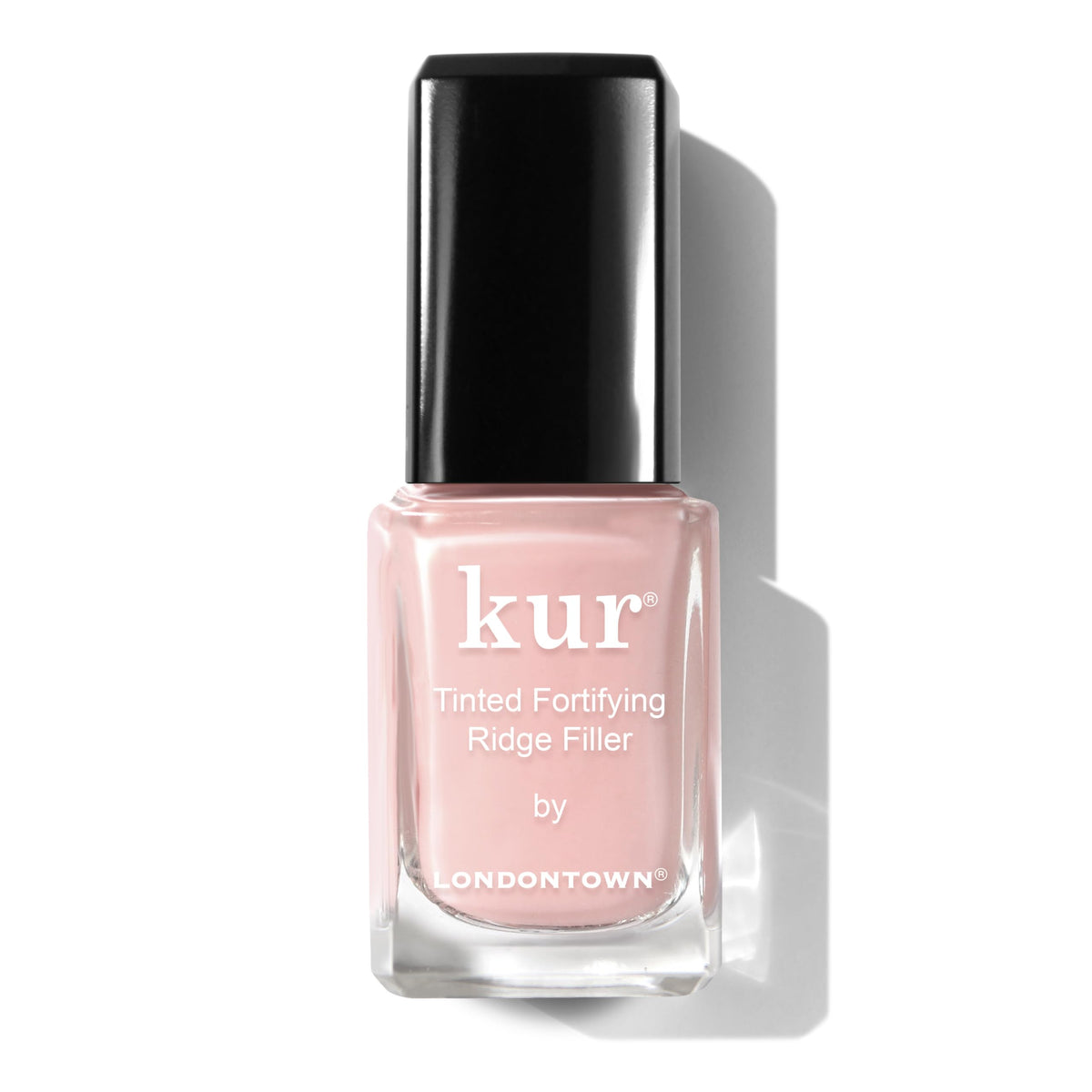 LONDONTOWN Kur bottle front showing petal pink tint and sleek packaging benefit: clear product ID