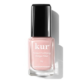 LONDONTOWN Kur bottle front showing petal pink tint and sleek packaging benefit: clear product ID