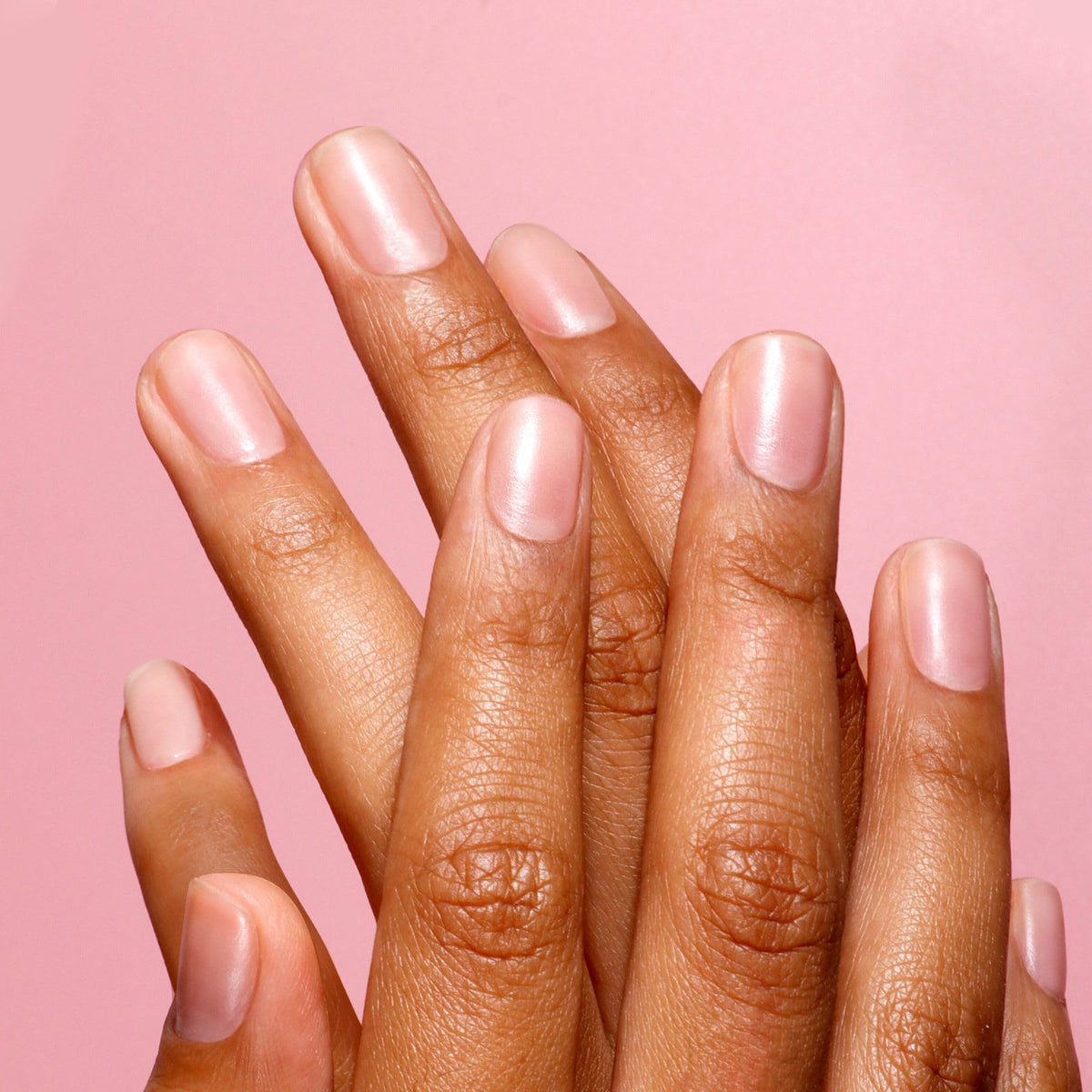 LONDONTOWN Kur on a natural nail plate showing sheer tint benefit: uniform appearance
