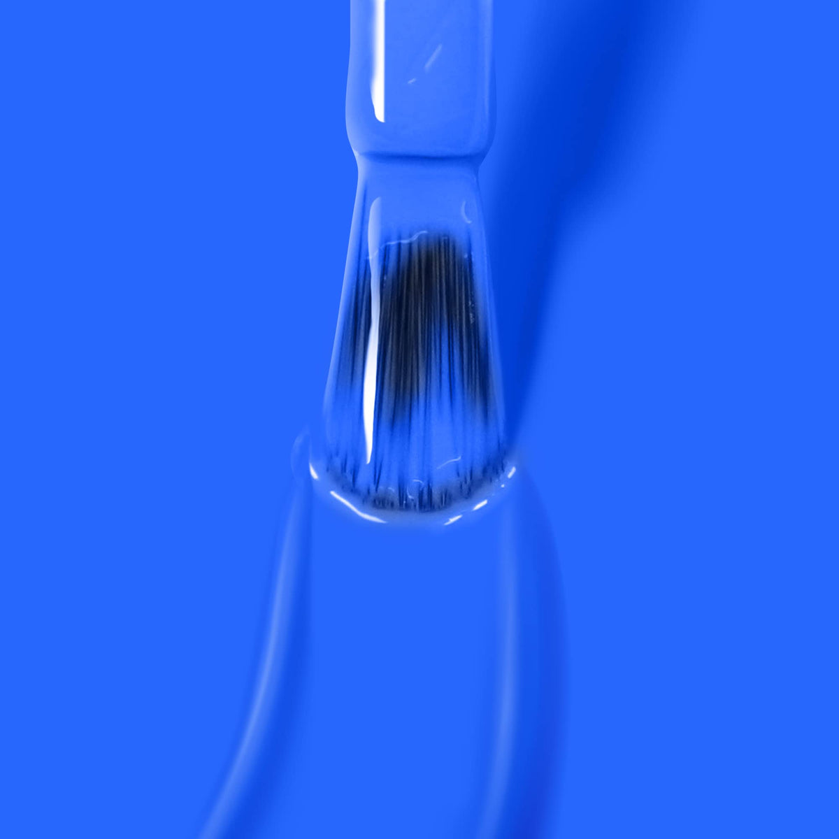 LONDONTOWN polished fingernails in Iconic Blue showing glossy, chip-resistant finish