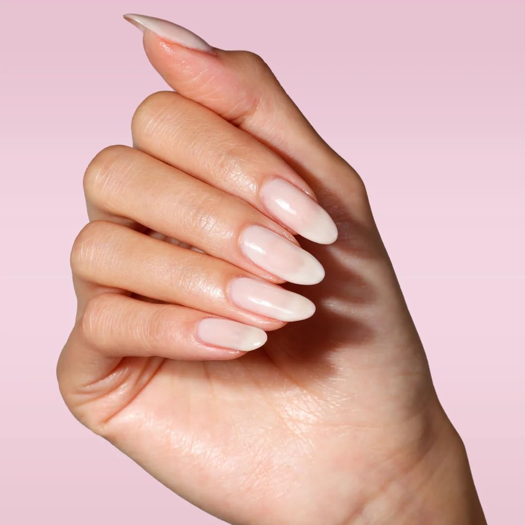 LONDONTOWN polish held in hand to show 0.4 fl oz scale and portability