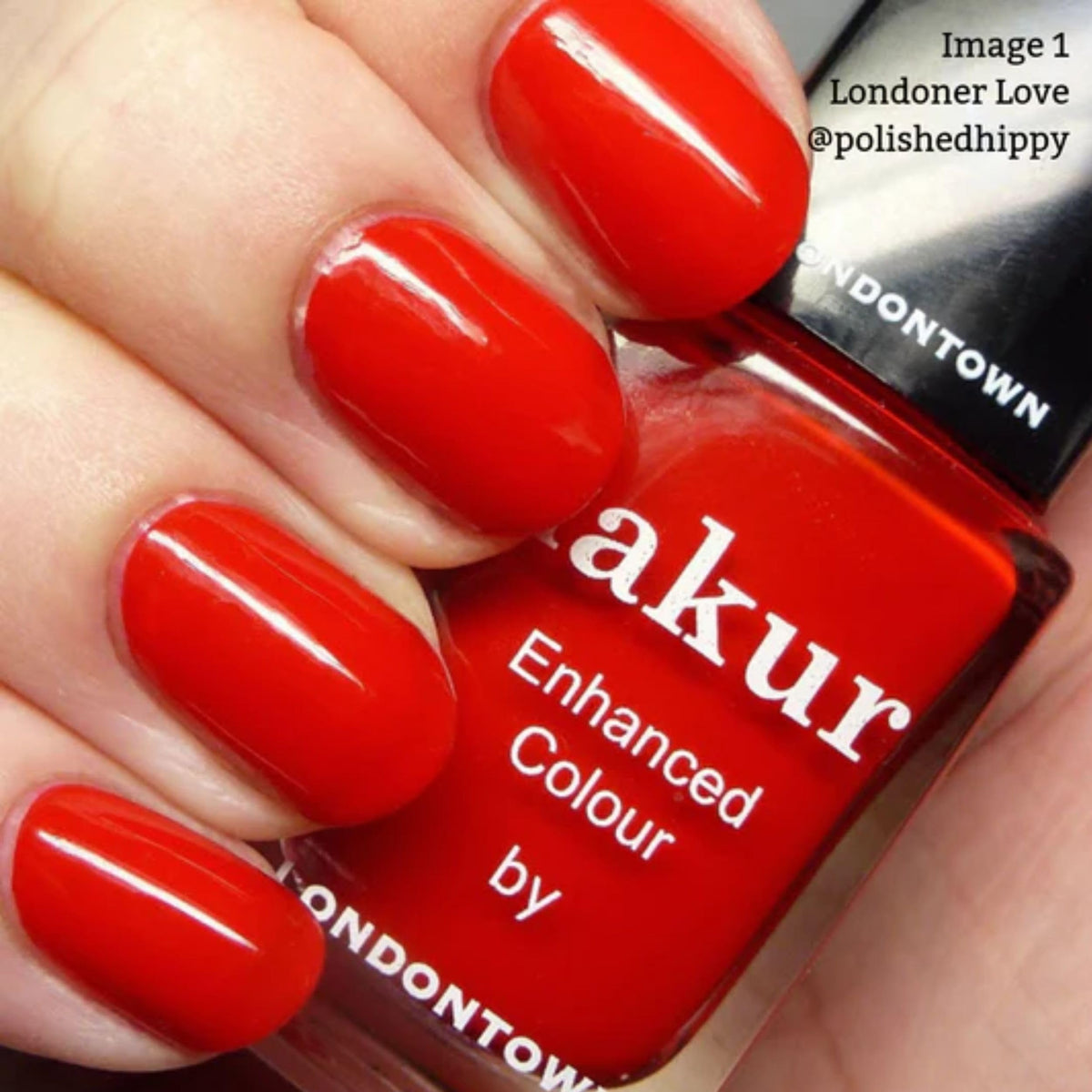 LONDONTOWN swatch on nails showing pigmented, salon-quality red color