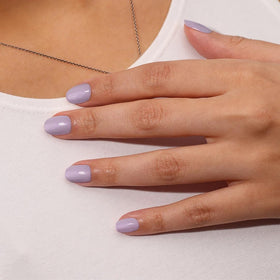 LONDONTOWN polished nails in honey lavender on a hand showing salon results
