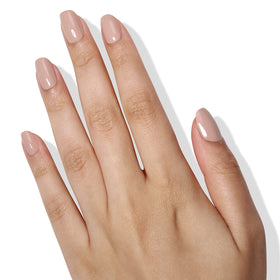 LONDONTOWN on model hand showing wearable nude manicure for everyday elegance