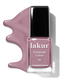 LONDONTOWN Lakur bottle next to coin to show 0.4 fl oz scale benefit