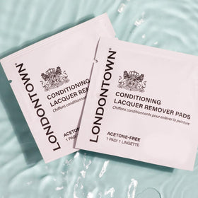 LONDONTOWN pads in a purse depicting easy on-the-go polish touch-ups