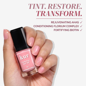 LONDONTOWN on model nails in natural light demonstrating a subtle, polished look