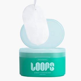 LOOPS pre-soaked pad with milky cleanser visible demonstrating effective makeup dissolve