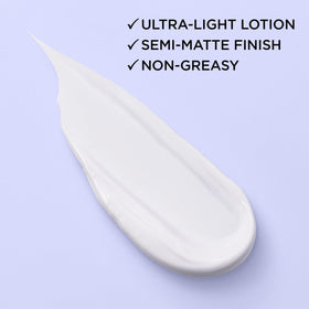 L'Oreal Paris moisturizer being dispensed to show easy application