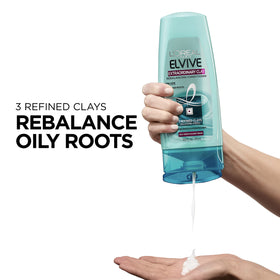 L'Oreal Paris Elvive conditioner applied in hand demonstrating easy spread