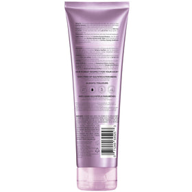 L'Oreal Paris shampoo on bathroom shelf conveying everyday salon-style routine
