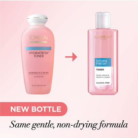 L'Oreal Paris bottle in hand showing scale and easy usage