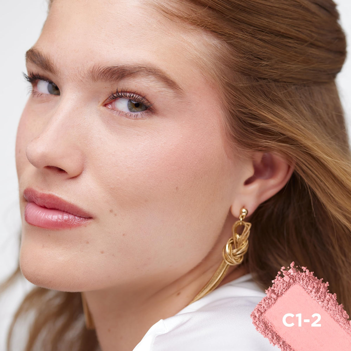 L'Oreal Paris swatch on skin showing natural rosy color payoff and buildability