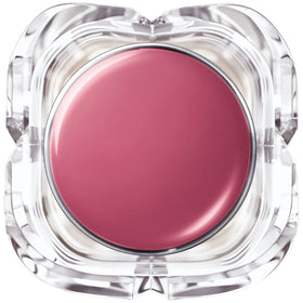 L'Oreal Paris lipstick beside a coin to show 0.1 oz size and portability