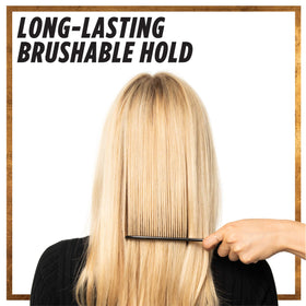 L'Oreal Paris Elnett held in hand shows travel size convenience and portability