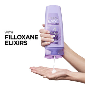 L'Oreal Paris conditioner texture at open cap demonstrating light cream