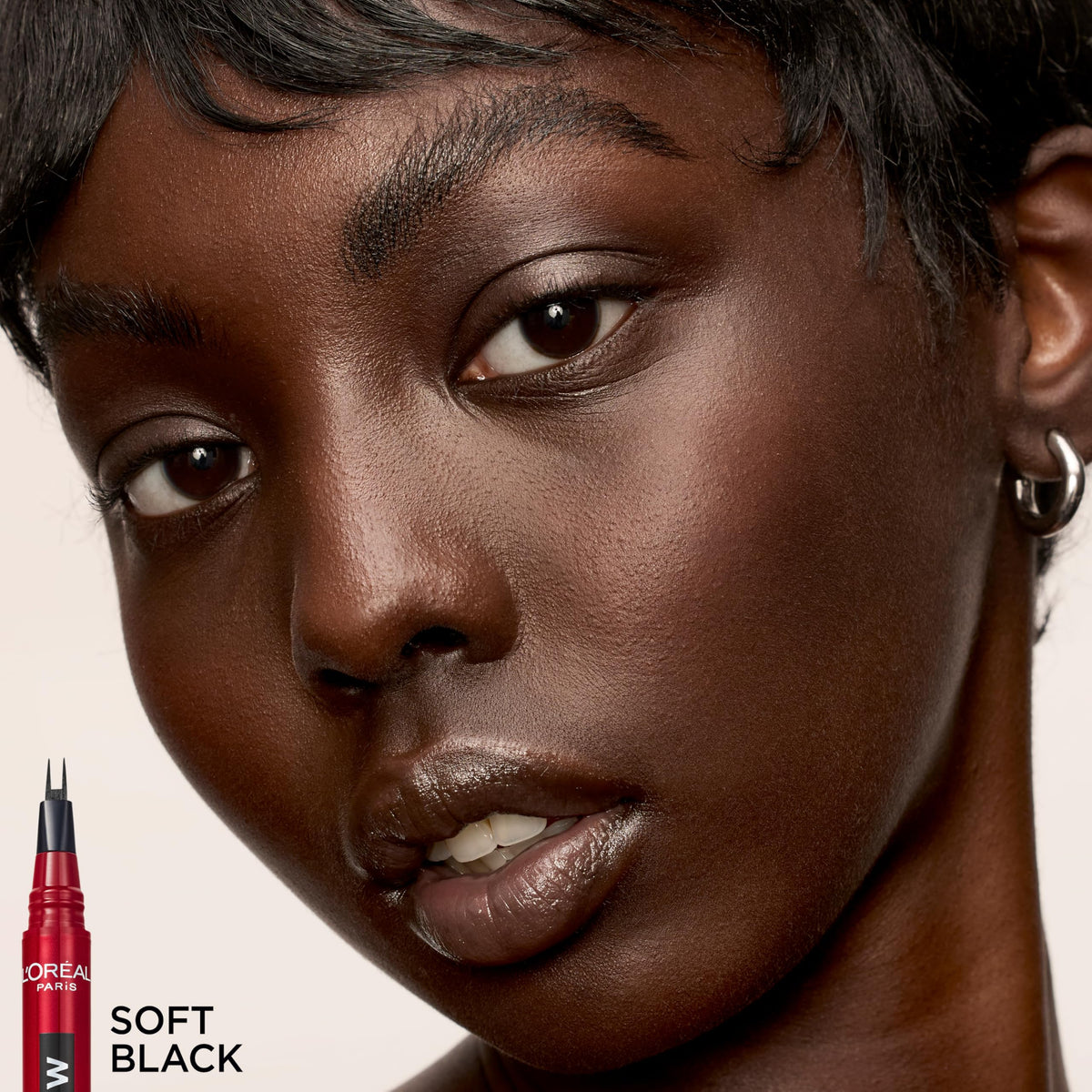 L'Oreal Paris faux brow lifestyle bathroom mirror scene shows quick application ease