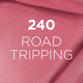 L'Oreal Paris wearer applying Road Tripping 240 outdoors for long-lasting confidence