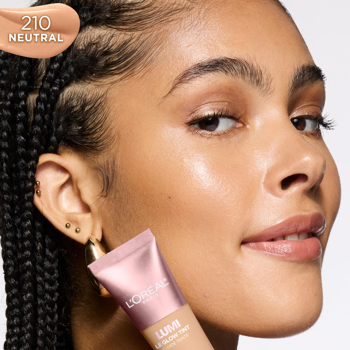 L'Oreal Paris Le Glow applied on model showcasing dewy finish