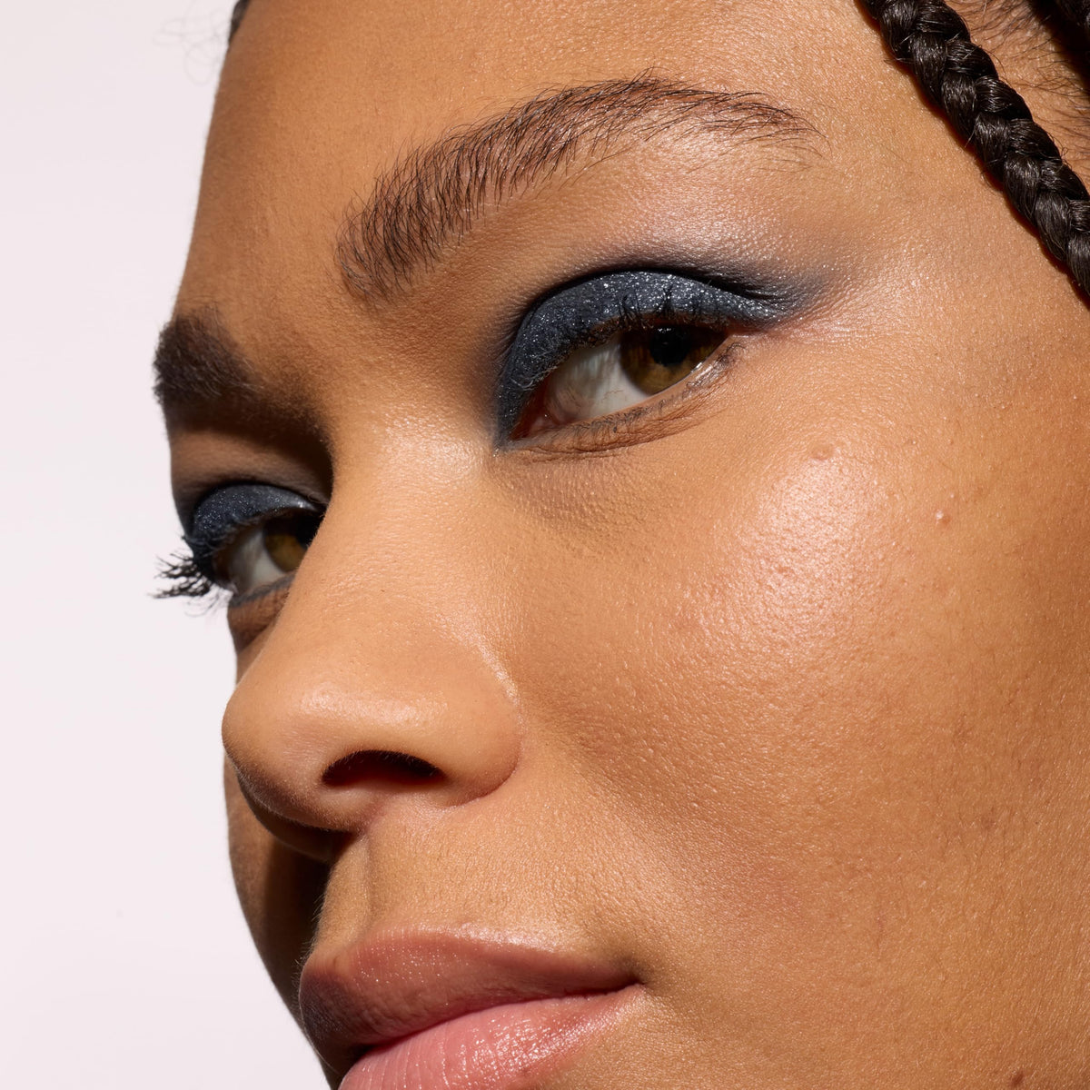 L'Oreal Paris Le Shadow Stick applied to eyelid showing smooth blend and smokey finish