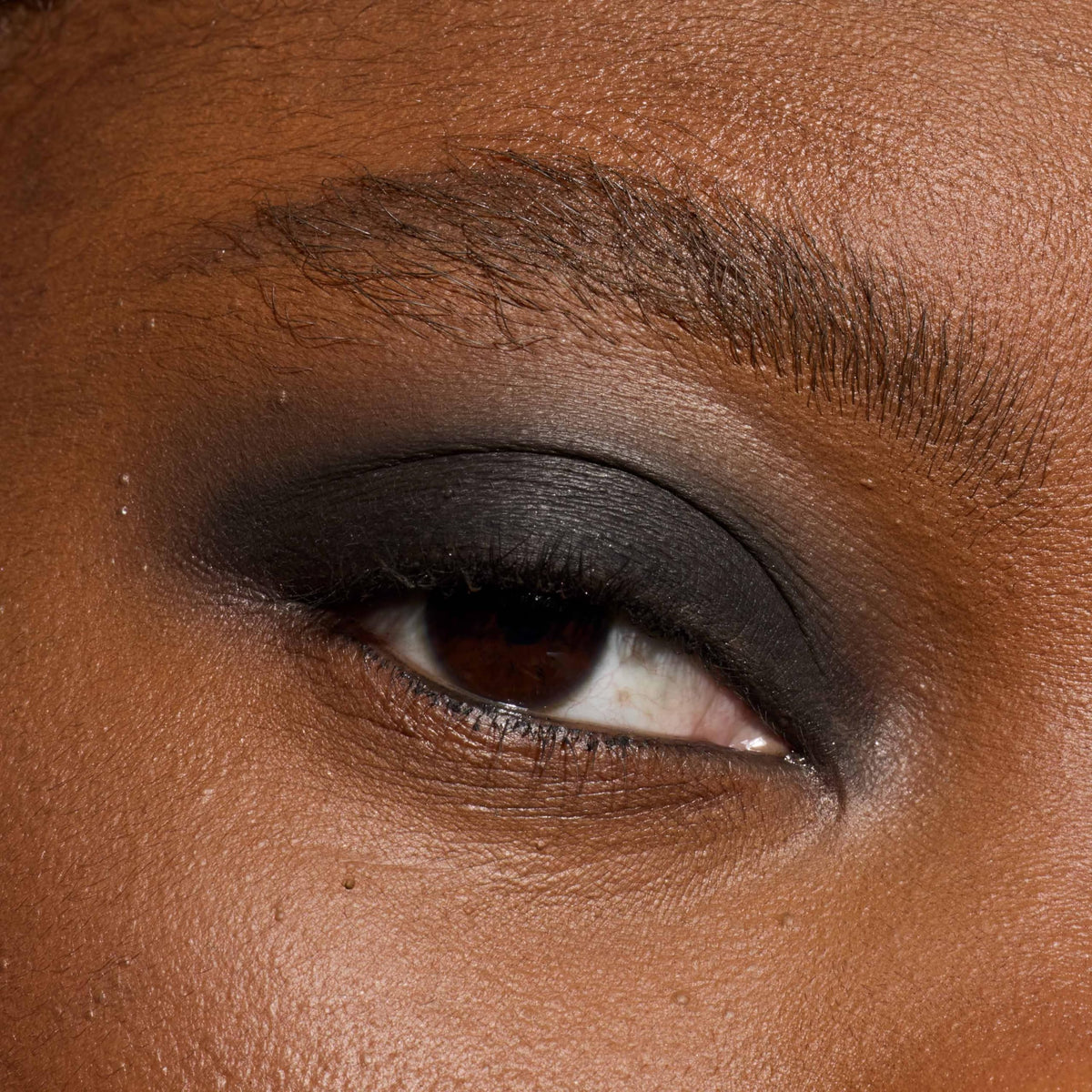 L'Oreal Paris Le Shadow Stick tucked inside makeup bag for on-the-go touchups