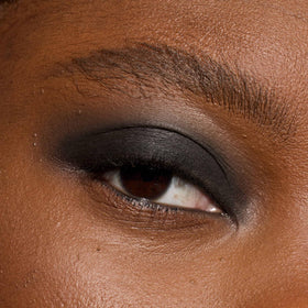 L'Oreal Paris Le Shadow Stick tucked inside makeup bag for on-the-go touchups