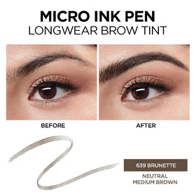 L'Oreal Paris pen held in hand showing compact travel-friendly size