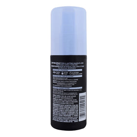 L'Oreal Paris bottle held in hand to show 3.4 oz size and travel-friendly portability