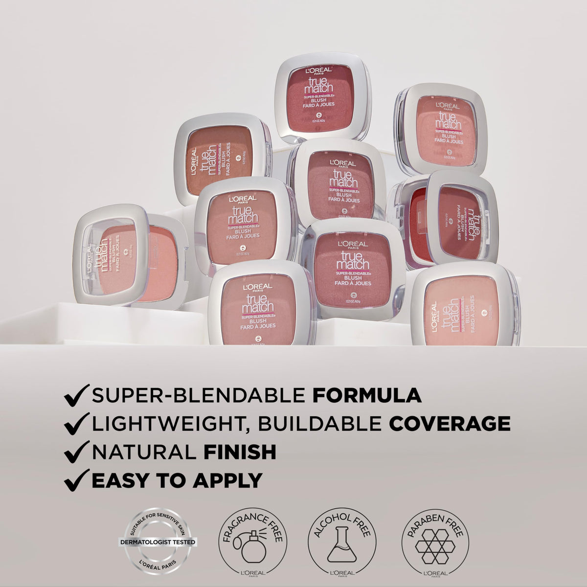 L'Oreal Paris compact beside lipstick showing compact size for travel
