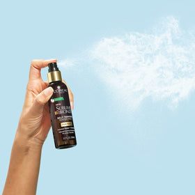 L'Oreal Paris bottle staged on bathroom vanity suggesting simple morning skincare routine