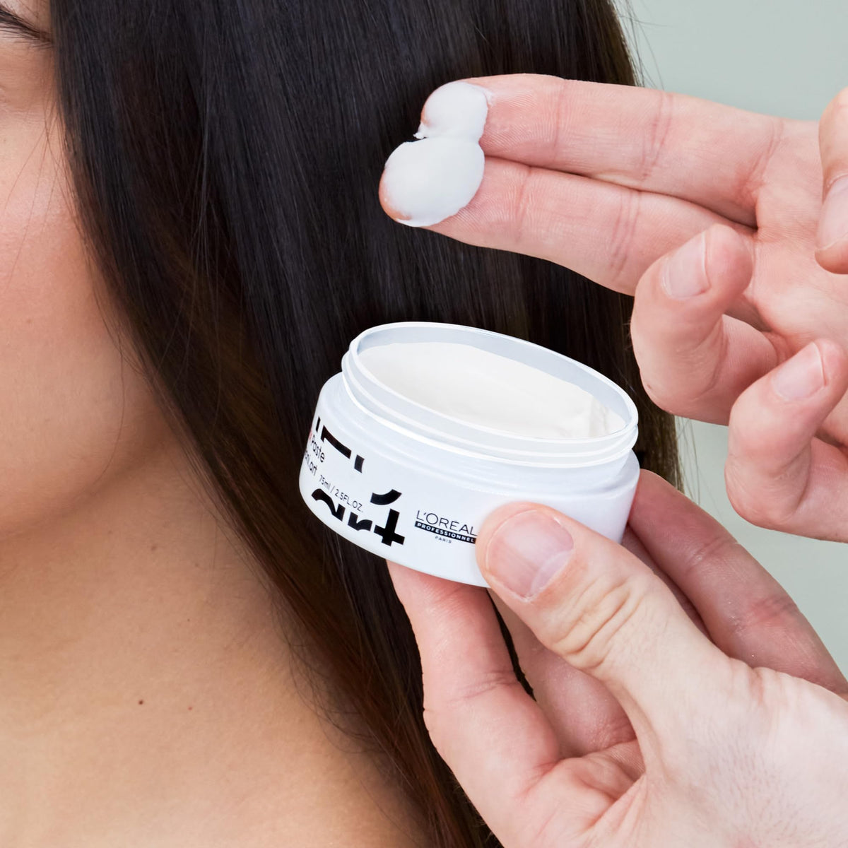 L'Oréal Professionnel Paris in barbershop setting showing professional styling results and long-lasting control