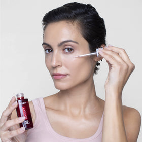 L'Oreal Paris Revitalift application in a nighttime routine demonstrating easy layering benefit