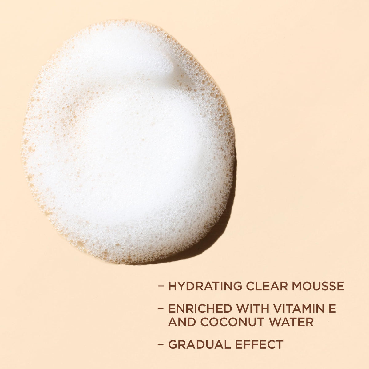 L'Oreal Paris close-up of lightweight mousse texture demonstrating quick absorption