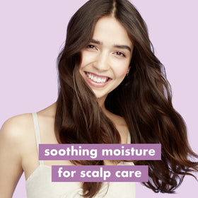 Love Beauty and Planet rich lather on hair demonstrating gentle cleanse