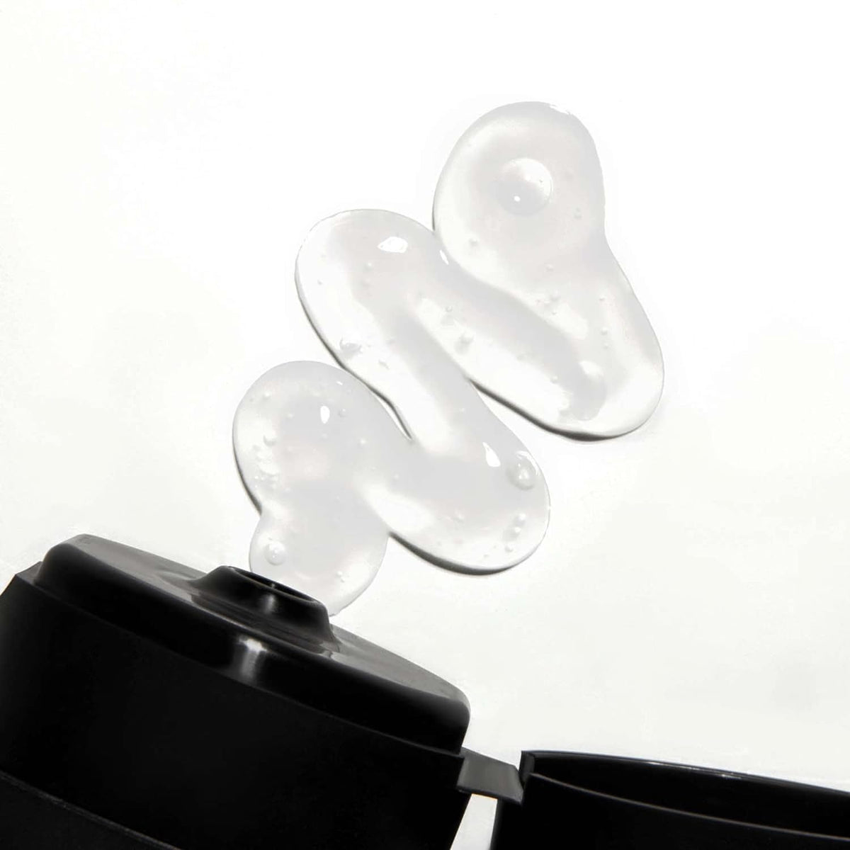 Love Ur Curls size comparison next to hand illustrating product scale