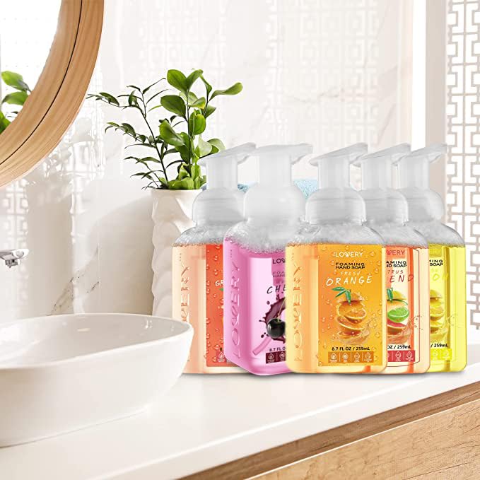 LOVERY bottle size comparison in hand illustrating compact convenience