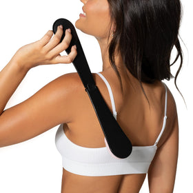 Loving Tan applicator being used on a back for streak-free tanning