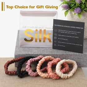 LOVUITEN scrunchie held in hand to show scale and comfortable elastic stretch