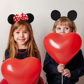 Lucky Will child wearing mouse ears headband at party showing playful fun
