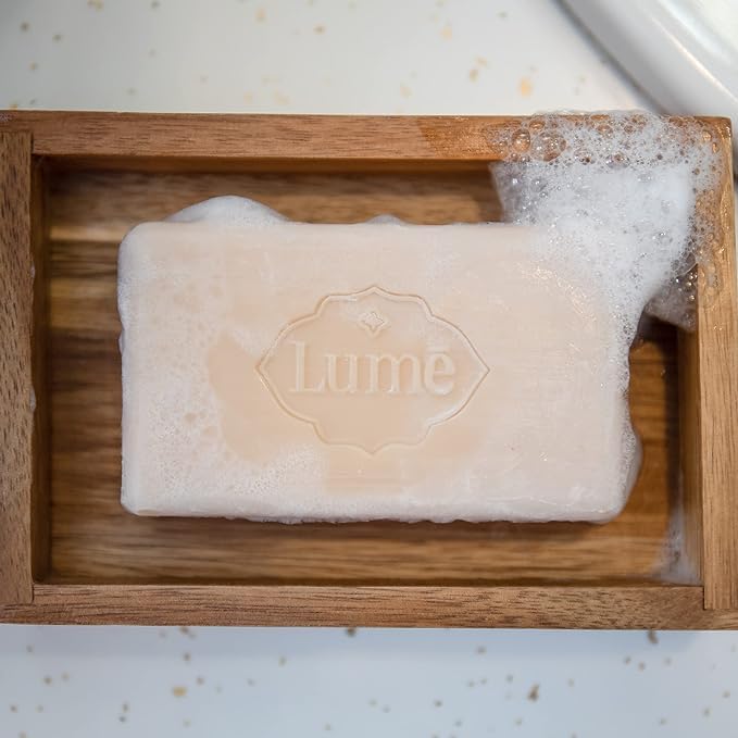 Lume bar used while shaving showing slick lather for smoother razor glide