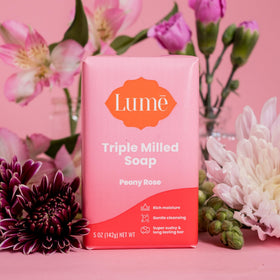 Lume bar in hand for scale indicating 5 ounce size and travel convenience