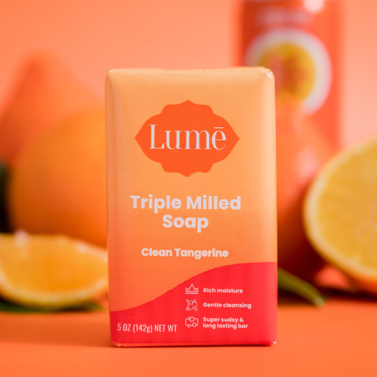 Hand holding Lume 5 oz bar to demonstrate true size and scale