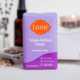 Lume soap staged with lavender and sage props evoking calming scent benefits