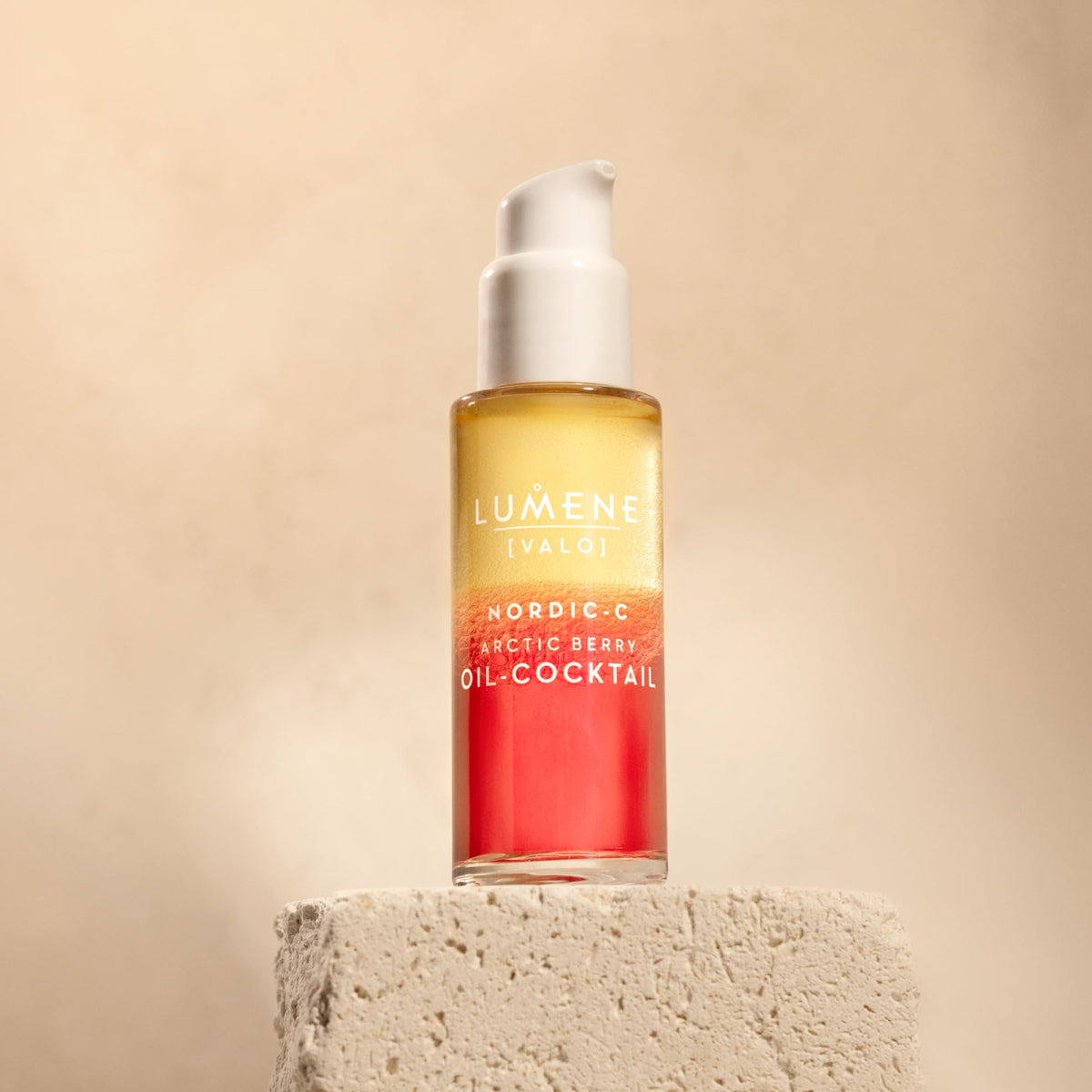 Lumene bottle held in hand showing product size and travel friendly benefit
