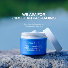 Lumene 50 ml jar beside everyday items to show scale and travel-friendly compact size