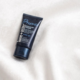 Lune+Aster primer with apple seed and licorice flatlay highlighting natural actives